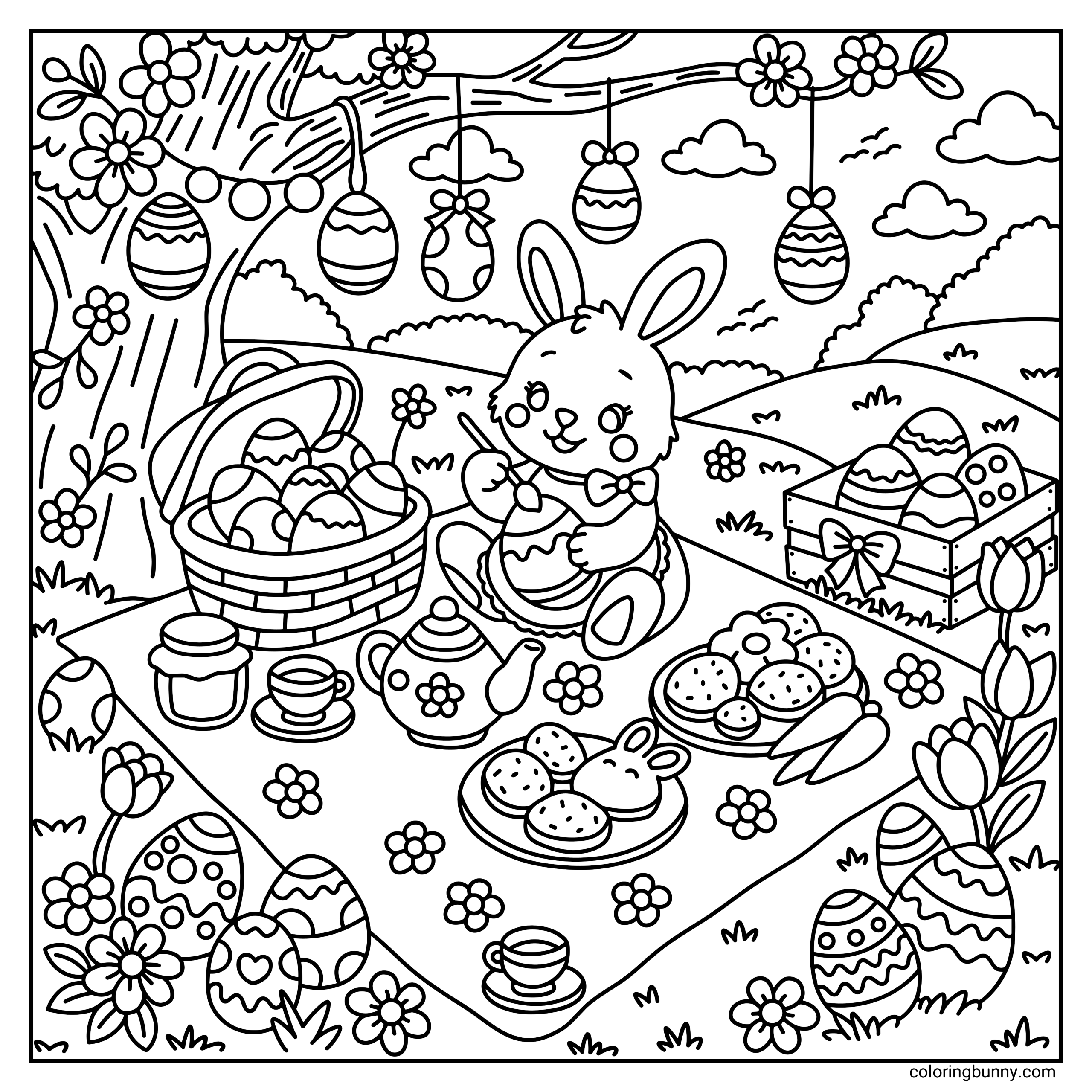A hand-drawn cozy Easter coloring page featuring a cheerful bunny sitting on a picnic blanket beneath a blossoming tree with decorated Easter eggs hanging from its branches. The bunny paints a patterned egg beside a basket filled with eggs, a wooden crate of decorated eggs, a teapot and teacups, plates of bunny-shaped cookies and pastries, carrots, flowers, and rolling spring hills in the background.