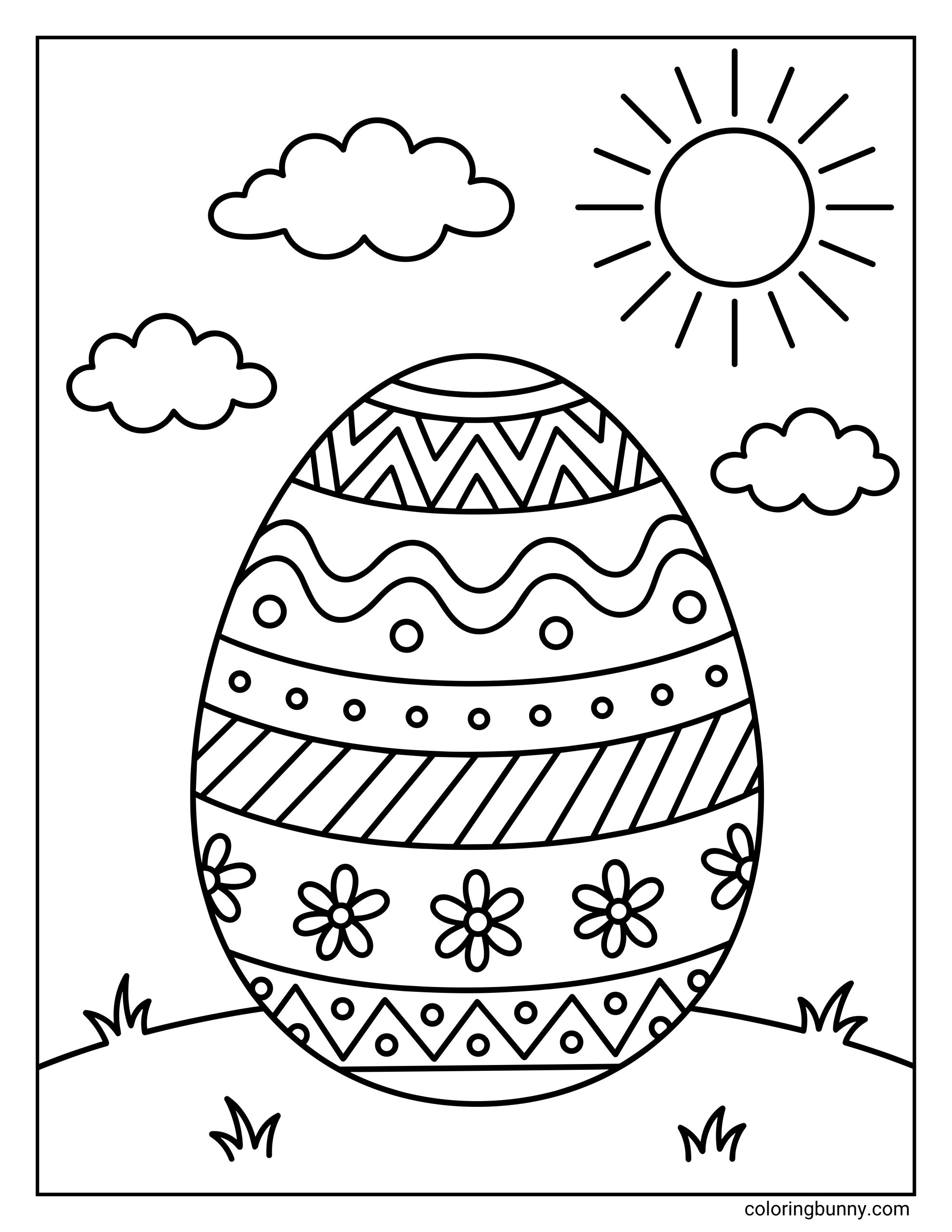A simple Easter egg sits on a grassy hill, decorated with zigzags, wavy lines, dots, stripes, and flowers. The sky above is filled with fluffy clouds and a bright sun with rays.