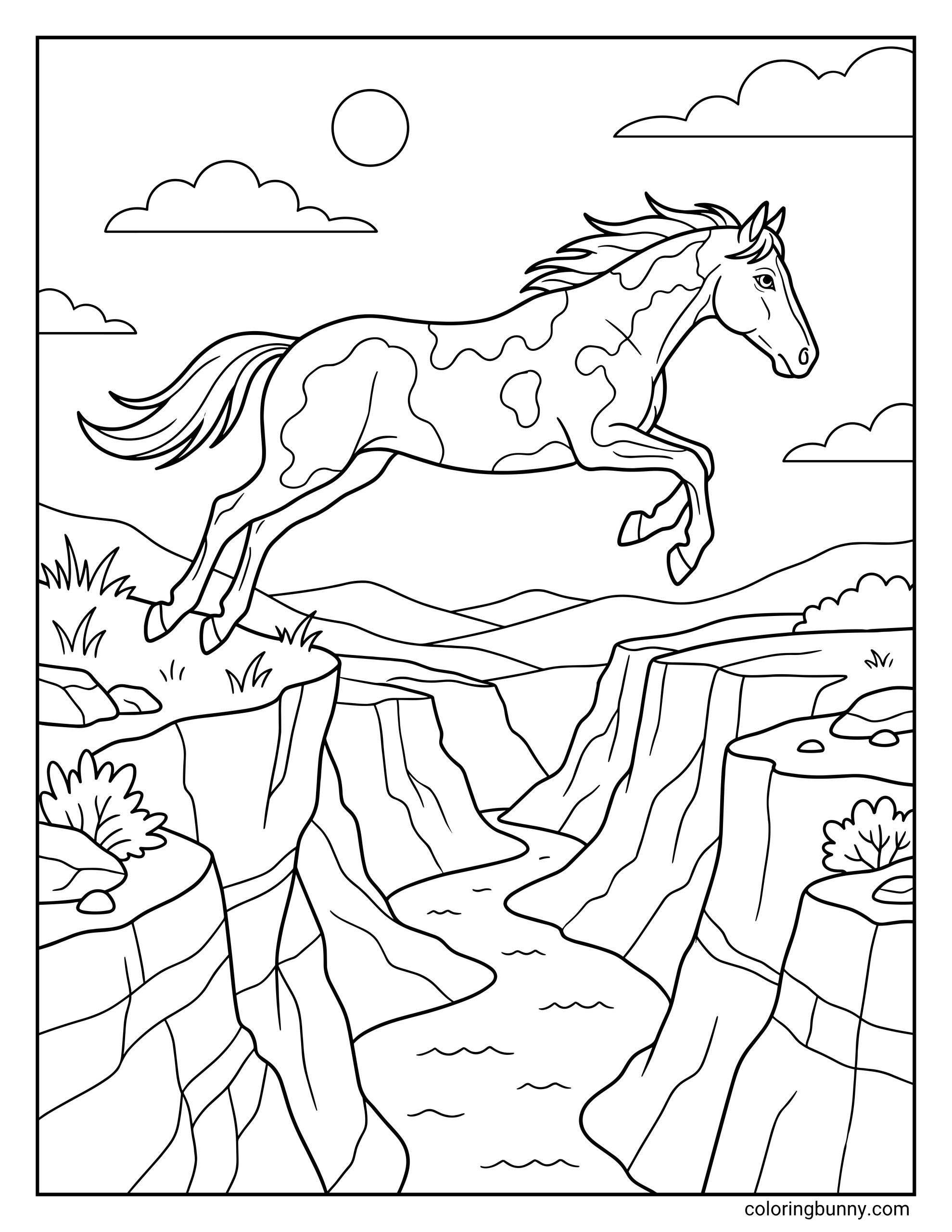 A coloring page of a pinto horse jumping over a wide canyon gap, showing spotted coat patterns, stretched legs, mountains, cliffs, water, and desert plants.
